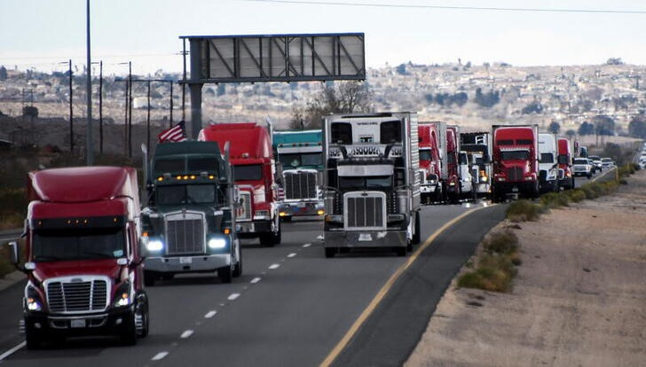 Truckers and their supporters form a convoy bound for the nation